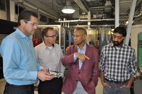 Image - Prof. Amar Mohanty giving a tour of the BDDC to representatives from Ecosynthetix