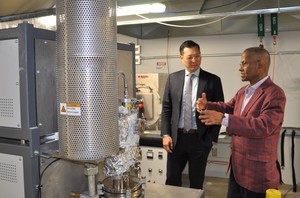 Dr. Mohanty showing Stan Cho some of the equipment in the BDDC.