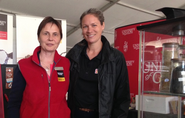 BDDC member, Milka Popov, with attendee at the International Plowing Match and Rural Expo (IPM)