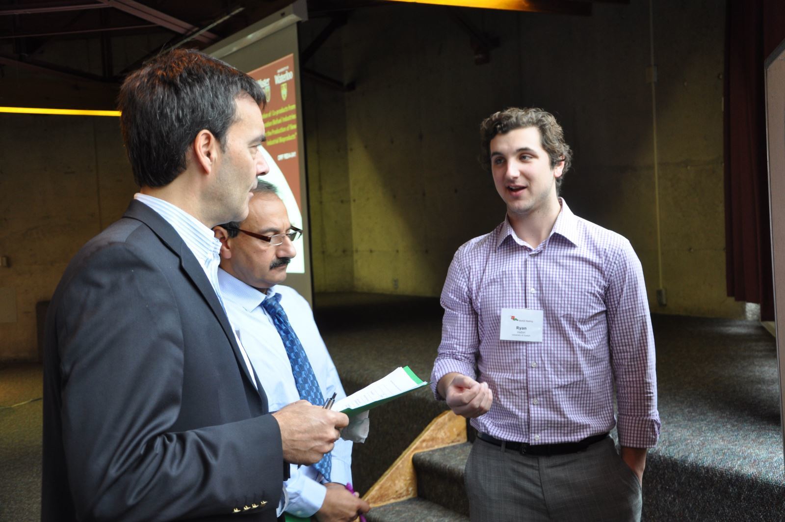 Three BDDC researchers having a discussion at the 2nd Annual BioNIB meeting