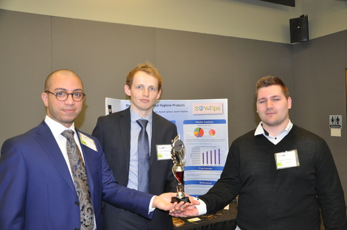 Miguel, Kjeld, and Gareth holding their 2nd place trophy.