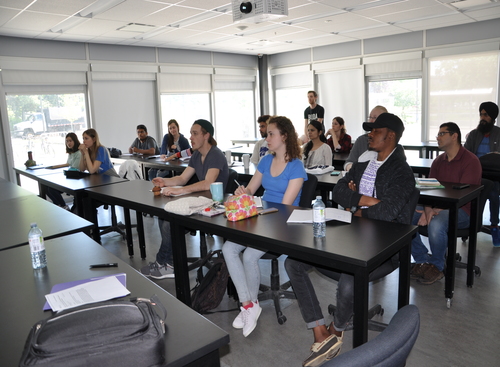 BDDC students listening to presentation