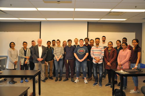 Jim Grey and group photo of graduate class.